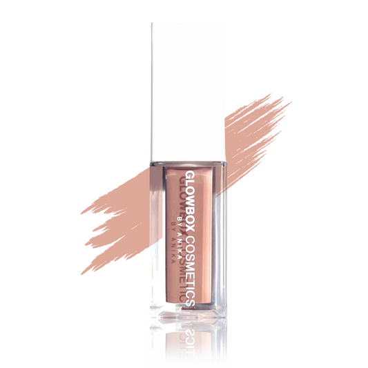 This shiny Cleopatra lip gloss in a clear container with a white cap. The gloss has a nude, tan brown tint with a thick consistency and is non-sticky. There is a swatch of the brown gloss shade to the back of the gloss tube. The gloss tube reflection is s